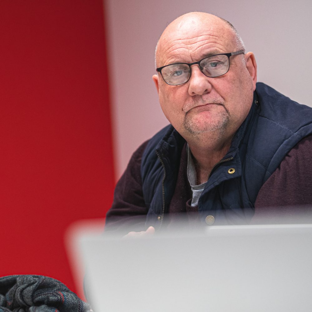 Paul looking at a laptop