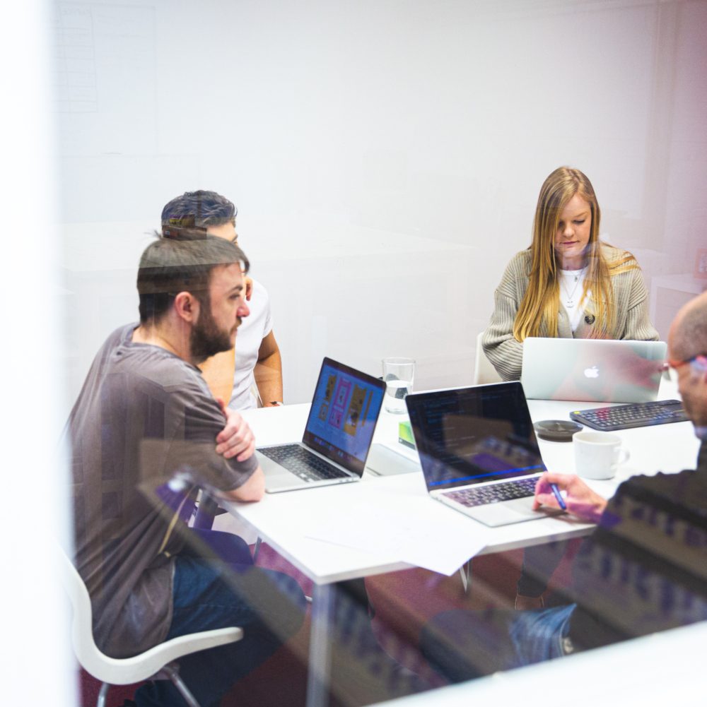 Sam, LIam C and the team working hard on their macbooks