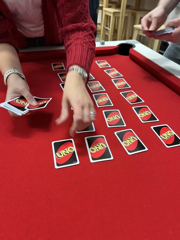 Uno cards on the pool table